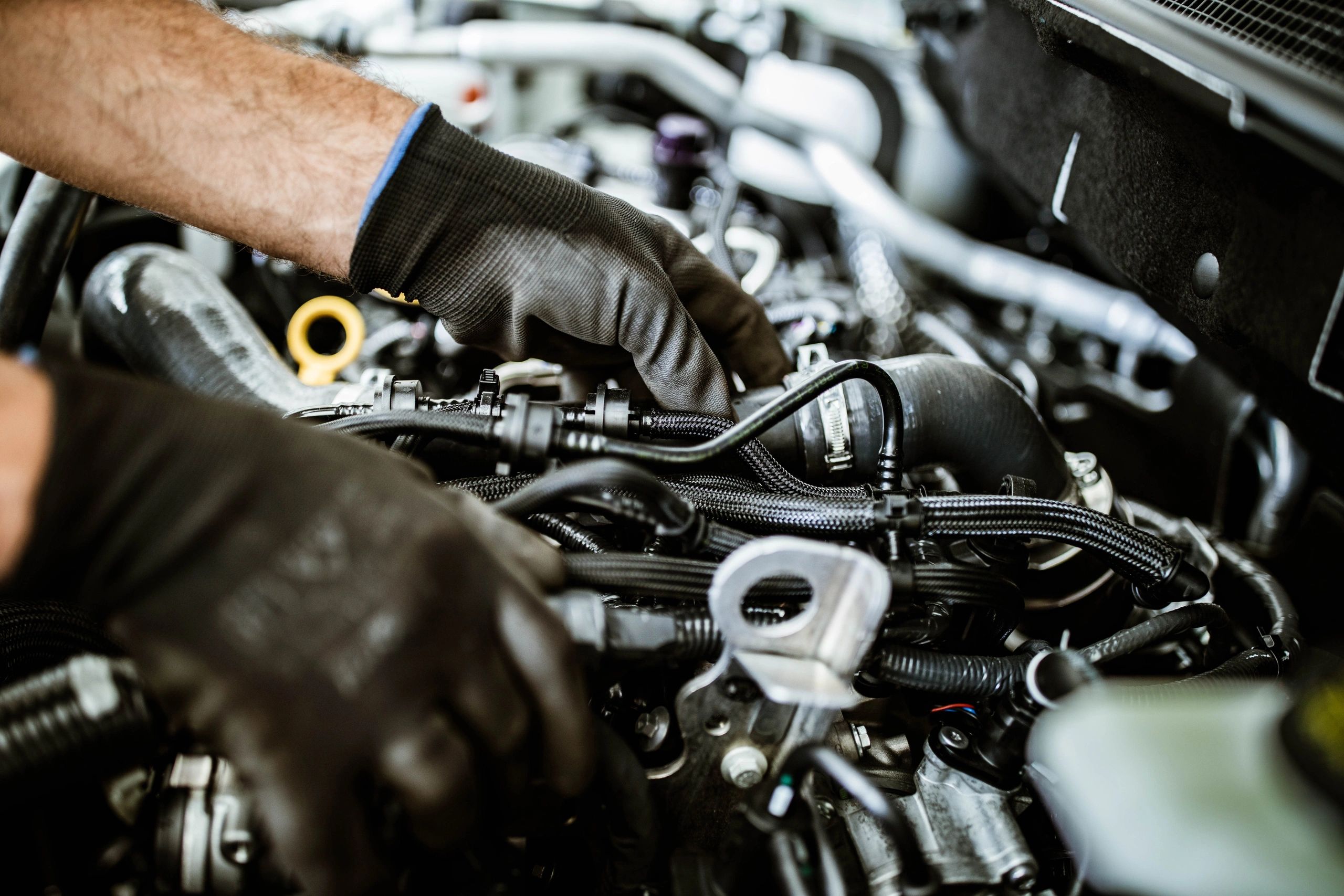 Mechanic examining an automotive component