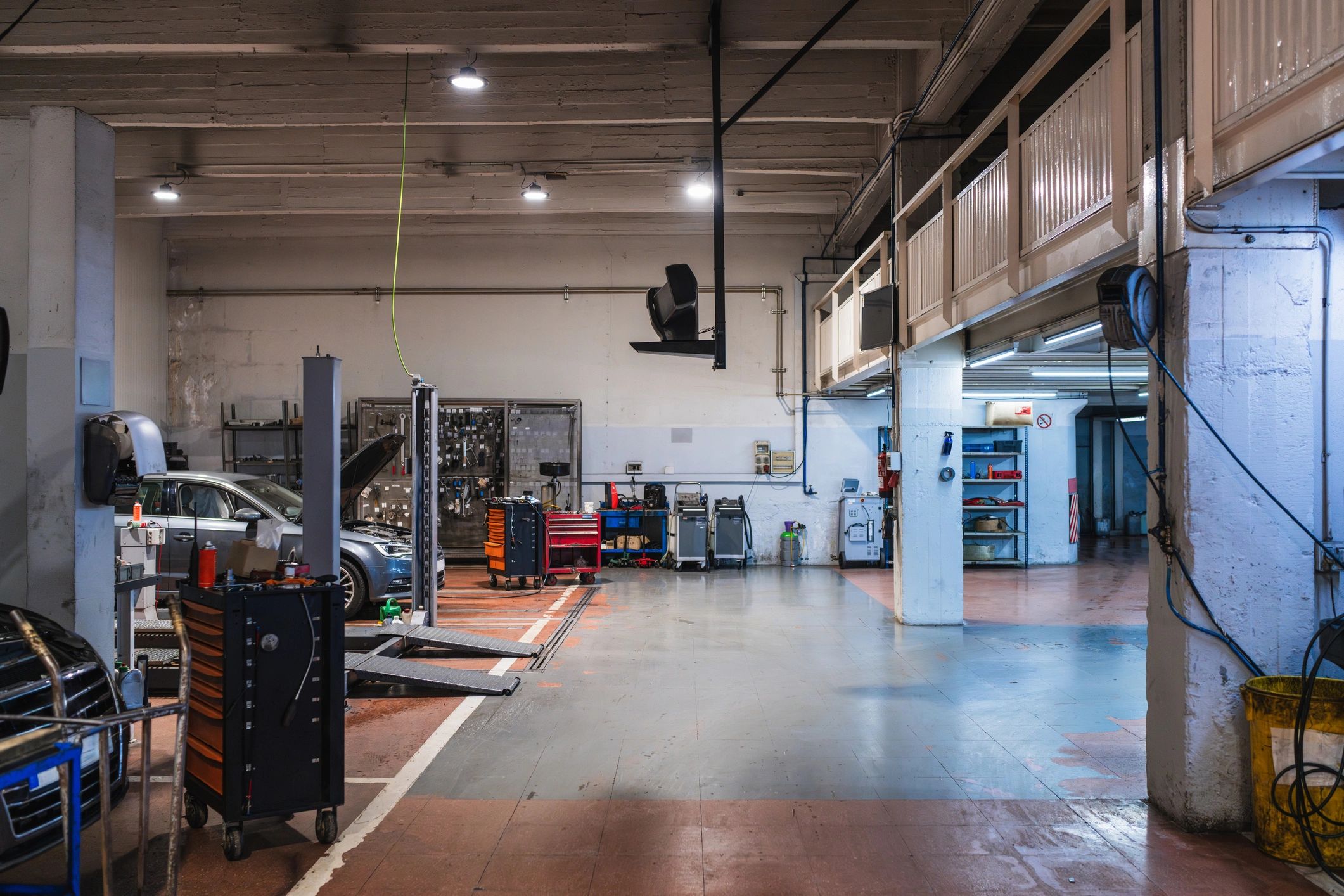 Car repair shop with lifts and toolboxes