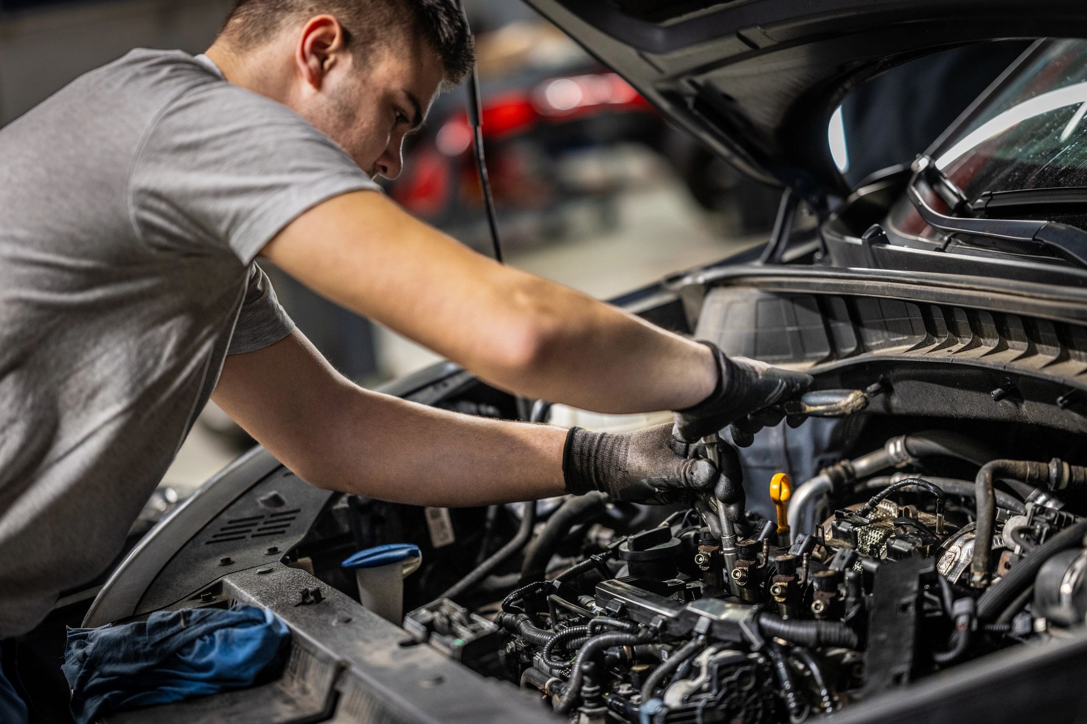 Mechanic performing engine maintenance