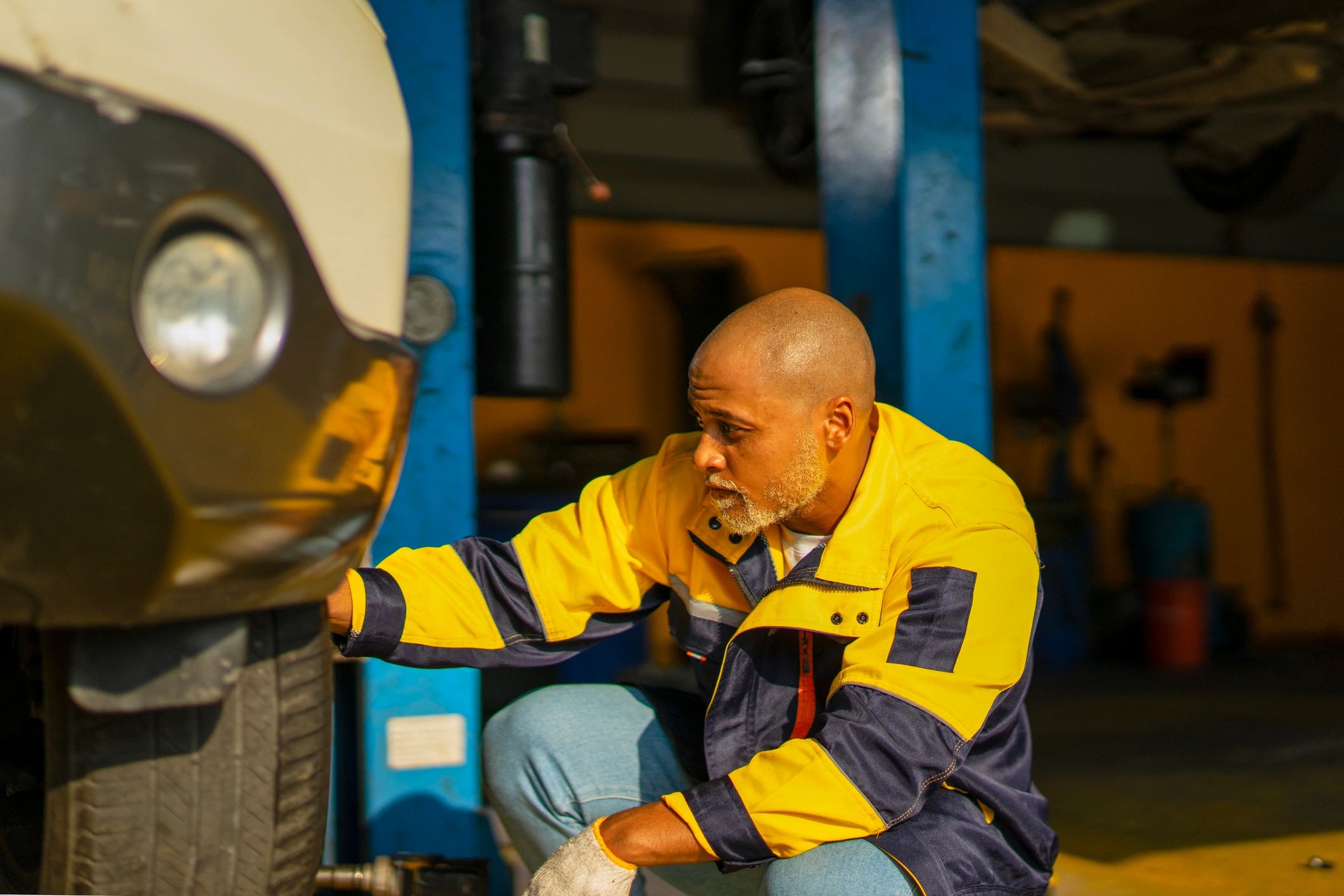 Mechanic working in an automotive service workshop